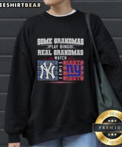 Official New York Yankees and New York Giants sweatshirt: 'Some Grandmas Play Bingo, Real Grandmas Watch' design.