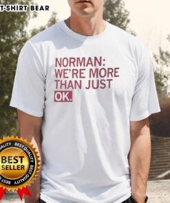 Alt Text: Official Norman We'Re More Than Just Ok T-Shirt featuring a trendy design and vibrant colors for casual wear.