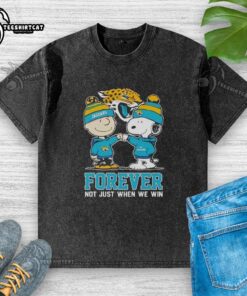 Alt Text: Official Peanut Snoopy Charlie Brown Jacksonville Jaguars Forever T-Shirt in a stylish washed design for fans.