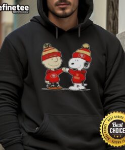 Charlie Brown and Snoopy fist bump in San Francisco 49ers football hoodie, perfect for Peanuts fans and football lovers.