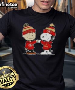 Alt Text: Official Peanuts Charlie Brown fist bump with Snoopy on San Francisco 49ers football t-shirt design.