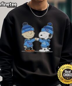 Official Peanuts Charlie Brown and Snoopy fist bump on Tennessee Titans football sweatshirt, perfect for fans.