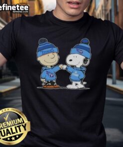 Official Peanuts Charlie Brown fist bump with Snoopy on Tennessee Titans football T-shirt, perfect for fans and collectors.
