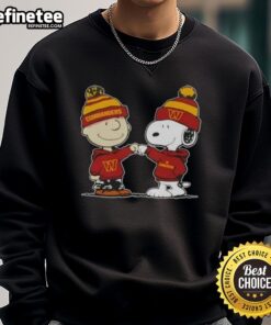Official Peanuts Charlie Brown fist bumping Snoopy on a Washington Commanders football sweatshirt design.