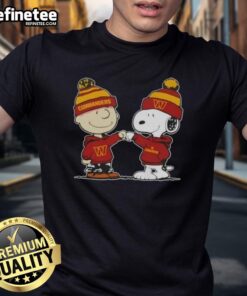 Official Peanuts Charlie Brown fist bumping Snoopy on Washington Commanders football t-shirt for fans.