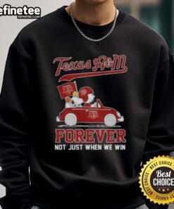 Charlie Brown and Snoopy driving a car on an Aggies sweatshirt, celebrating Texas A&M spirit and fandom.