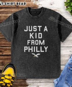 Official Philadelphia Eagles Just A Kid From Philly washed t-shirt featuring team logo and vintage design in green.