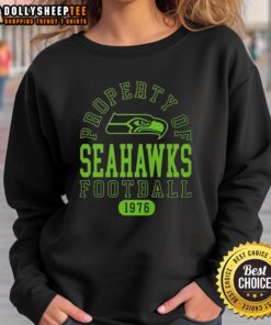 Official Seattle Seahawks sweatshirt, established 1976, featuring team logo and bold graphic design.