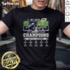 Alt Text: Official Seattle Seahawks NFC West Champions 2025-2026 Seed 1 helmet logo on a stylish t-shirt design.