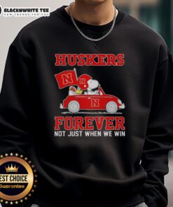 Alt Text: Official Snoopy and Woodstock driving car on Nebraska Huskers sweatshirt, featuring vibrant colors and playful design.