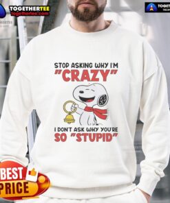 Official Snoopy sweatshirt featuring Snoopy holding a bell with the phrase about asking why, perfect for Peanuts fans.