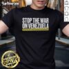 Alt Text: Official Stop The War On Venezuela T-Shirt featuring bold graphics and a powerful message against military intervention.