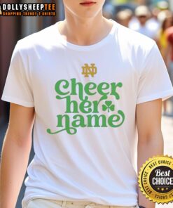 Alt Text: Official University of Notre Dame Cheer Her Name logo t-shirt featuring vibrant graphics and a comfortable fit.