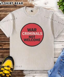 Official War Criminals Not Welcome washed t-shirt, featuring bold text on a casual, stylish design for protest wear.