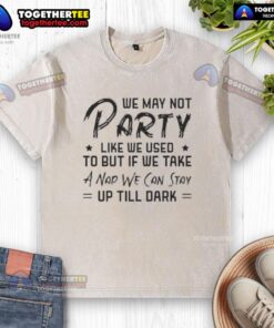 Alt Text: Official We May Not Party Like We Used To t-shirt featuring whimsical text design on a washed fabric background.