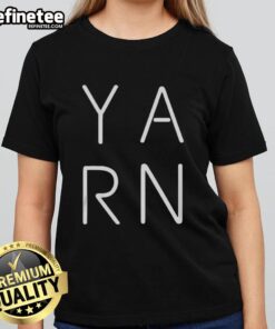 Official Y-A-R-N logo on a stylish ladies tee showcasing modern fashion and brand identity.