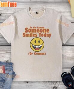 Original 'Be The Reason Someone Smiles Today or Cringes' washed t-shirt showcasing a fun and motivational design.