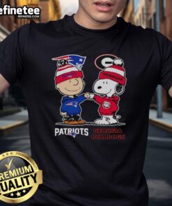 Alt Text: Original Charlie Brown New England Patriots vs Snoopy Georgia Bulldogs T-Shirt featuring vibrant graphics and sports logos.