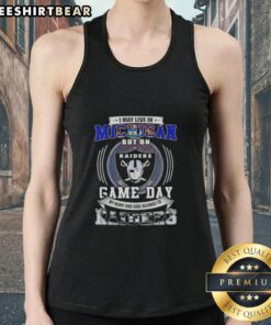 Person wearing a tank top that says 'My heart belongs to Las Vegas Raiders' while enjoying game day in Michigan.