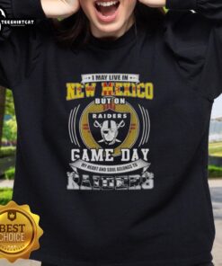 Alt Text: Comfortable sweatshirt featuring 'I May Live in New Mexico, But My Heart Belongs to Las Vegas Raiders' design.