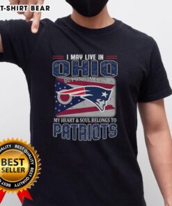 Ohio fan wearing New England Patriots flag t-shirt, showcasing team spirit on game day with pride and passion.