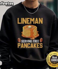 Original Lineman serving free pancakes while wearing a cozy sweatshirt, promoting community and delicious breakfast treats.