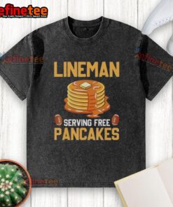 Original Lineman serving free pancakes wearing a washed t-shirt at a community event, promoting local camaraderie.