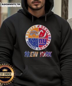 Alt Text: Original New York City Sports hoodie featuring Knicks, Devils, Giants, and Yankees logos in a stylish design.