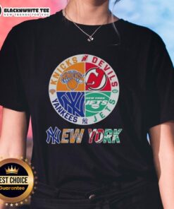 Combine of Knicks, Devils, Jets, and Yankees logos on a ladies tee, celebrating original New York City sports teams.