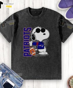 Original Peanuts Snoopy X New England Patriots football washed t-shirt featuring a playful Snoopy design in team colors.