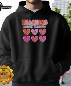 Original Teaching Sweet Hearts hoodie promoting respect, inclusivity, and learning through play for children.