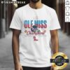 Alt Text: Original Ole Miss Rebels 2026 Fiesta Bowl Champions T-Shirt featuring football helmet design at State Farm Stadium.