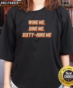 Original Wine Me Dine Me Sixty Nine Me ladies tee featuring a stylish design for wine lovers and casual wear enthusiasts.