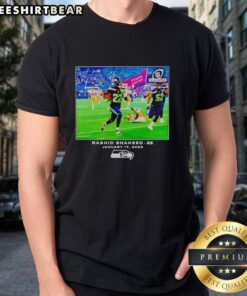 Alt Text: Original Seattle Seahawks Rashid Shaheed NFL Flash Features T-Shirt showcasing vibrant team colors and logo.