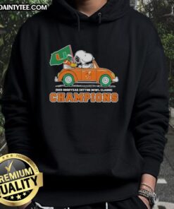 Alt Text: Premium 2025 Goodyear Cotton Bowl Classic Champions hoodie featuring Snoopy driving a car, celebrating Miami Hurricanes football.