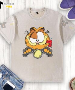 Alt Text: Premium cartoon Garfield cat riding a motorcycle on a stylish washed T-shirt design for cat lovers.
