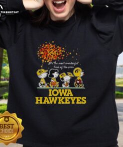 Alt Text: Premium Charlie Brown Sally Brown Snoopy Woodstock sweatshirt featuring Iowa Hawkeyes holiday design, perfect for winter.