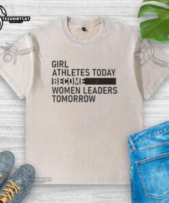 Premium washed t-shirt featuring 'Girl Athletes Today, Women Leaders Tomorrow' slogan, perfect for inspiring young athletes.