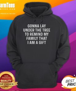 Premium hoodie featuring 'Gonna Lay Under The Tree To Remind My Family That I Am A Gift' design, perfect for cozy holidays.