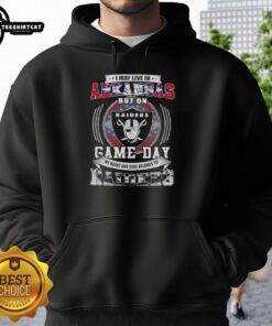 Premium hoodie featuring 'I May Live In Arkansas But My Heart Belongs To Las Vegas Raiders' design for football fans.