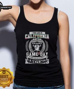 Premium tank top featuring 'I May Live In California, But My Heart Belongs To Las Vegas Raiders Football' design.