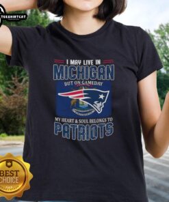 Premium ladies tee featuring 'I May Live In Michigan But My Heart Belongs To New England Patriots' flag design.