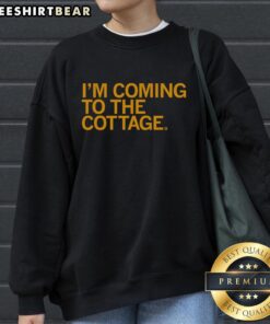 Premium 'Im Coming to the Cottage' sweatshirt featuring cozy fabric and stylish design, perfect for cottage getaways.
