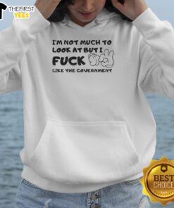 Premium 'I'm Not Much To Look At But I Fck Like The Government' hoodie in black, showcasing a bold graphic design.