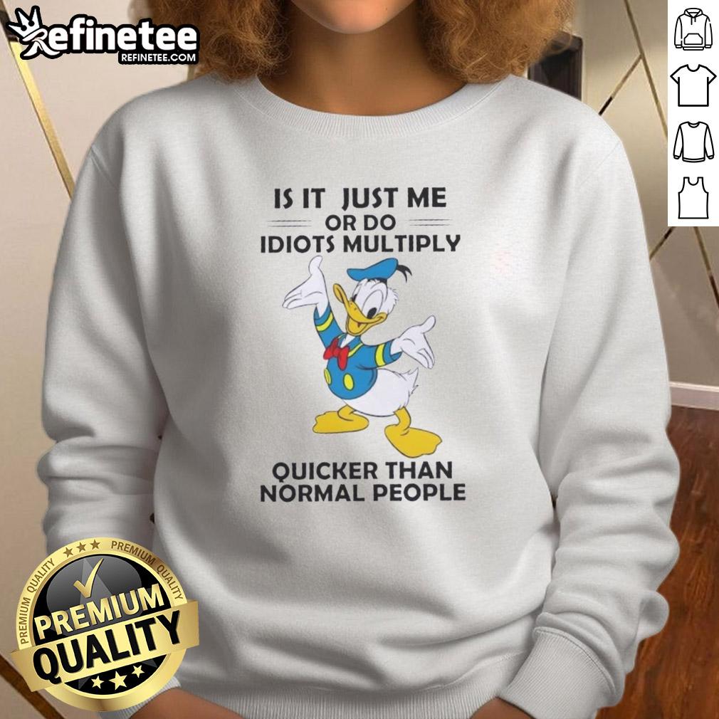premium-is-it-just-me-or-do-idiots-multiply-quicker-than-normal-people-donald-duck-sweatshirt Alt Text: Premium Donald Duck sweatshirt featuring the quote 'Do Idiots Multiply Quicker Than Normal People?' in vibrant colors.