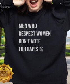 Premium sweatshirt featuring 'Men Who Respect Women Don't Vote for Rapists' message, promoting respect and awareness.