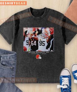 Alt Text: Premium Myles Garrett black Cleveland Browns NFL Flash Features Week 18 washed t-shirt showcasing team pride and style.