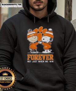 Alt Text: Premium Peanut Snoopy and Charlie Brown Clemson Tigers hoodie, celebrating fandom with Forever, Not Just When We Win slogan.