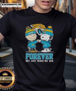 Premium Peanut Snoopy Charlie Brown Jacksonville Jaguars T-Shirt celebrating team spirit, perfect for fans all year round.
