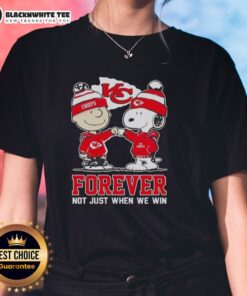Premium Peanut Snoopy & Charlie Brown Kansas City Chiefs tee for ladies, celebrating fandom beyond just winning.